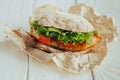 Fried fish Sandwich with lettuce, tomato with tartar sauce. author`s recipe street food Royalty Free Stock Photo